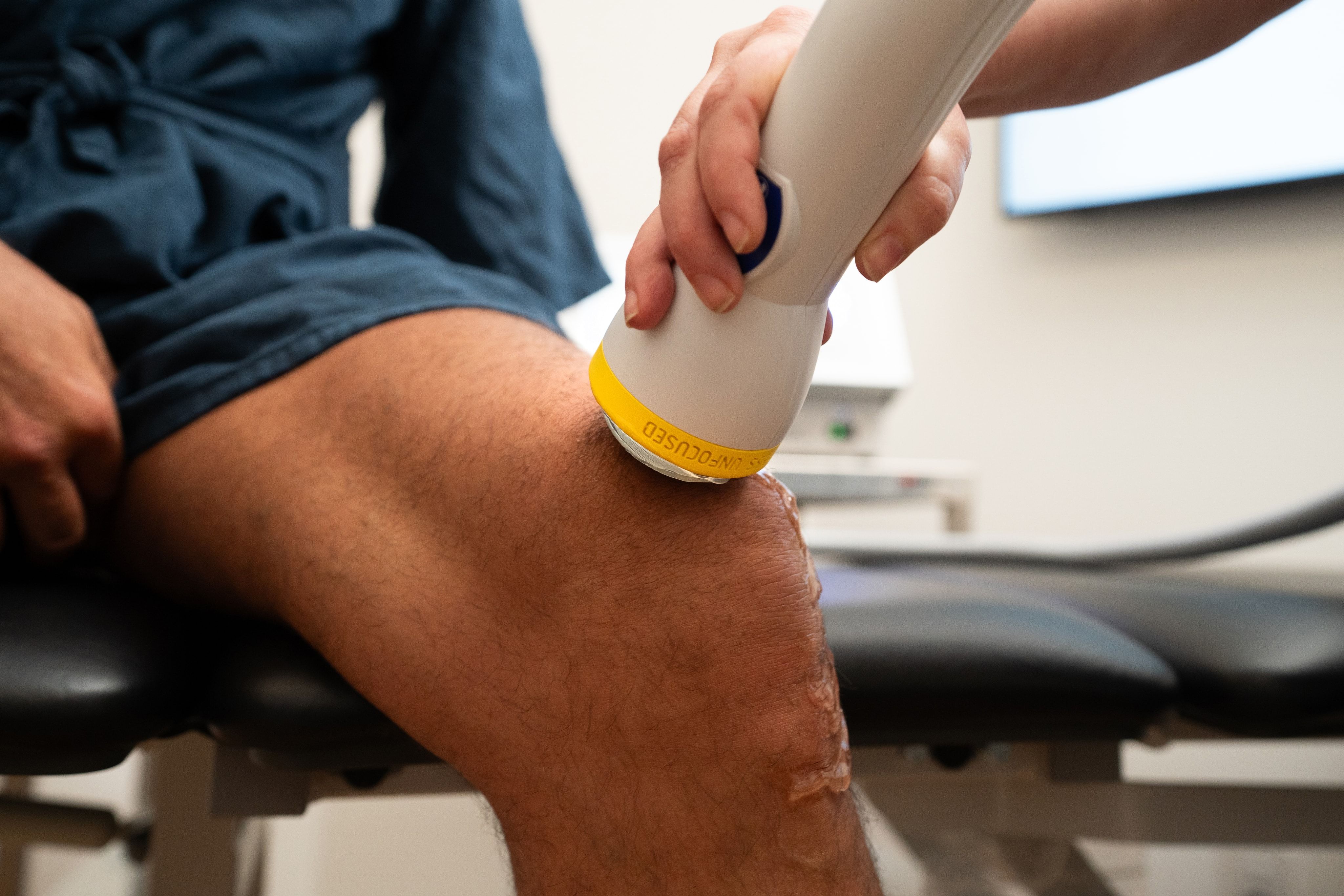 Shockwave therapy session — clinic photography