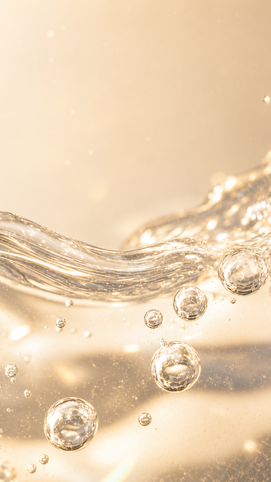 Liquid bubbles flowing upward in a warm gold IV drip