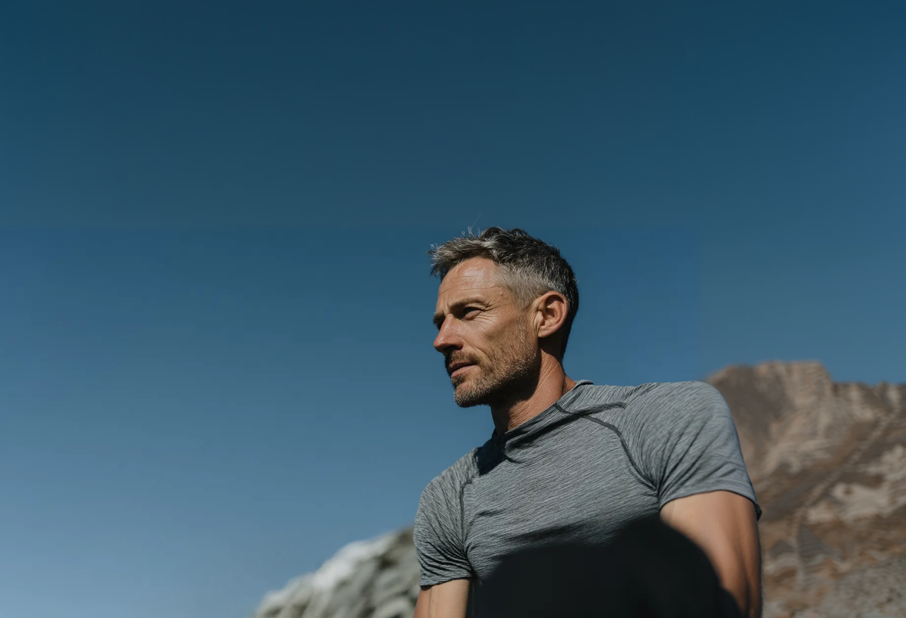 Older man in profile bathed in warm late-day light