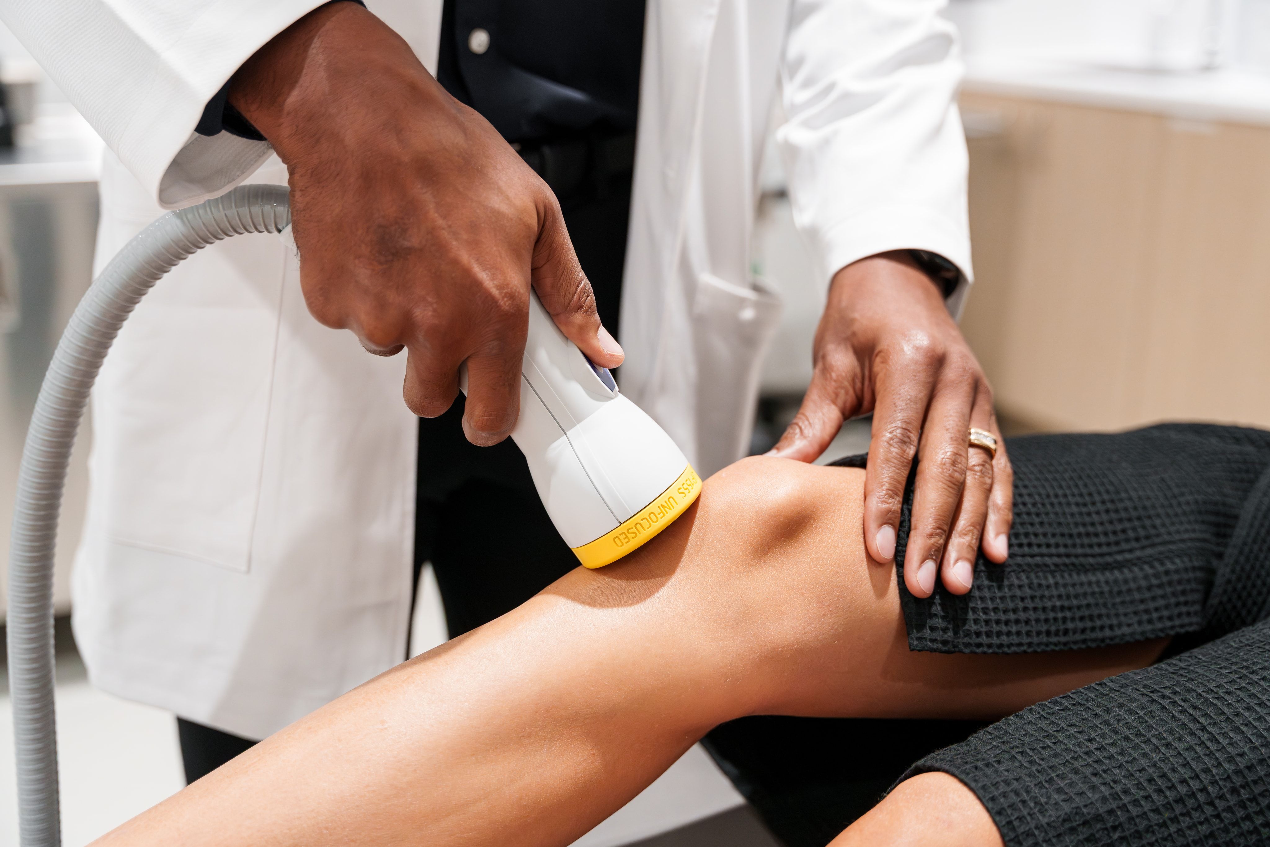 Shockwave therapy session — clinic photography