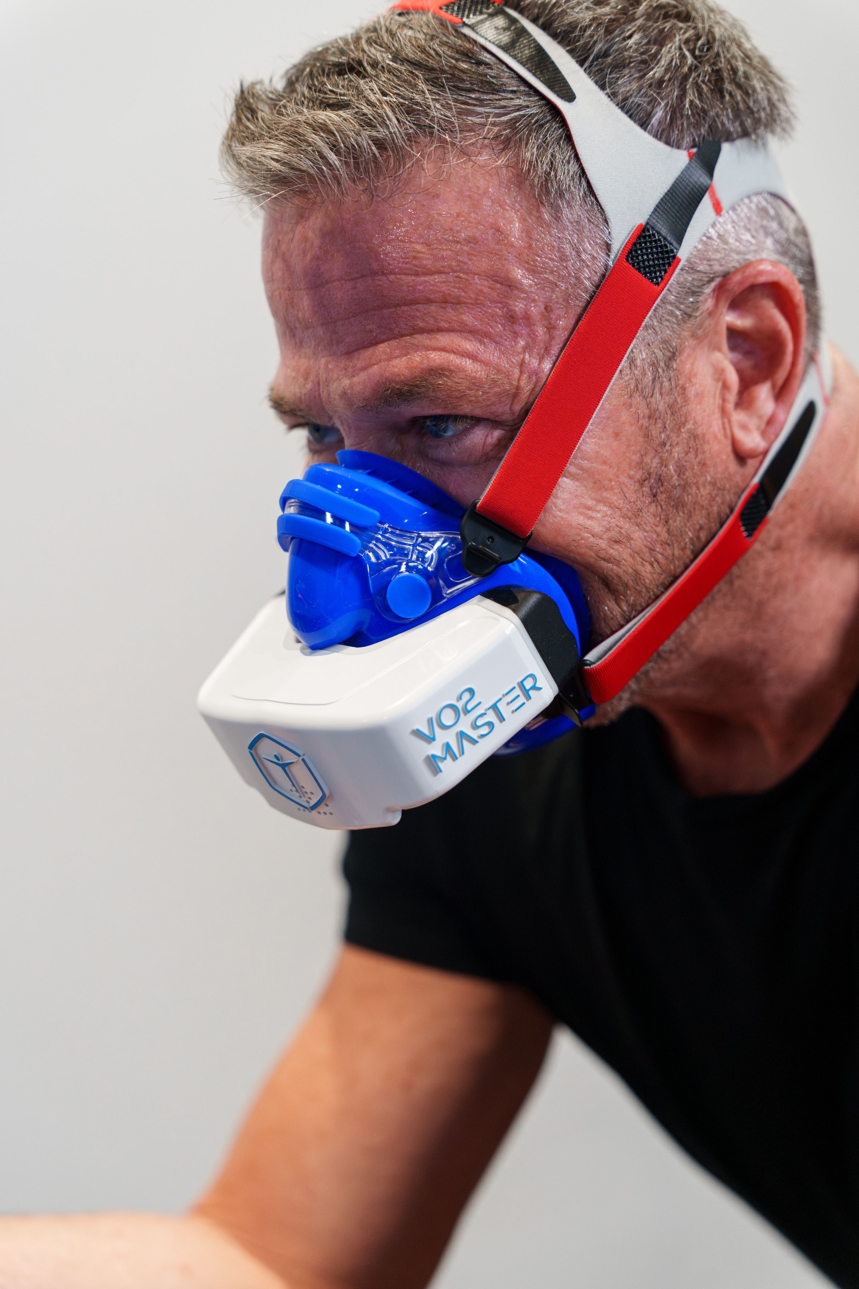 Patient wearing a VO2 Max breathing mask during testing